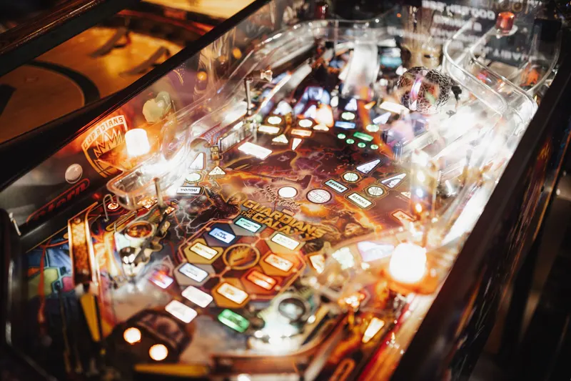 Colorful pinball machine in an arcade