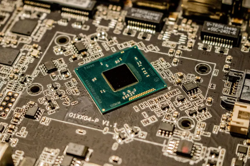 Close view of a microchip and surrounding circuit board