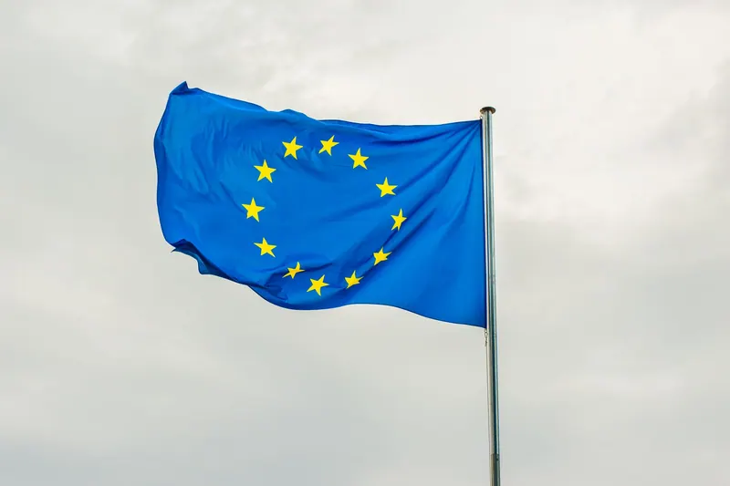 The European Union flag waving on a flagpole