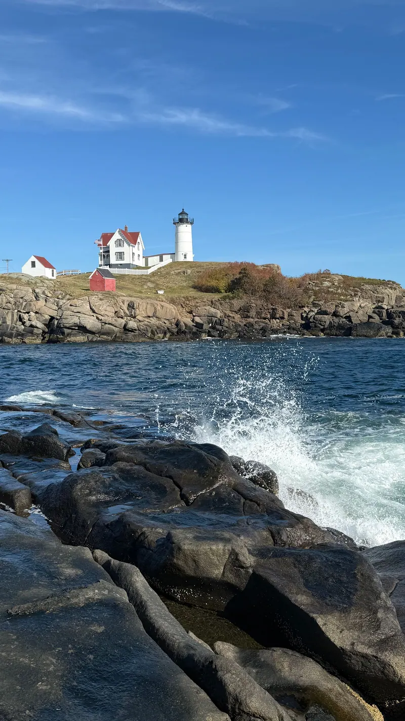 Lighthouse on a rocky Maine coastline