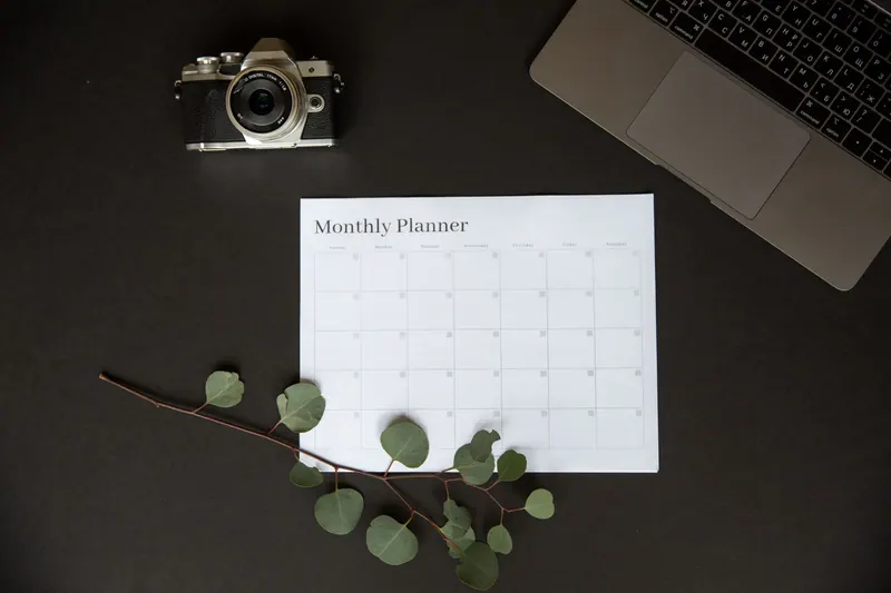 An open monthly planner on a light desk