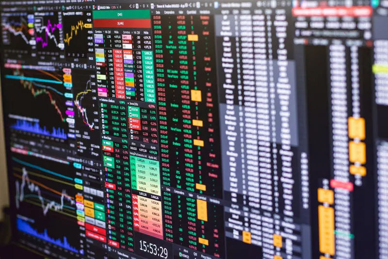 Financial trading screen with colorful charts and data